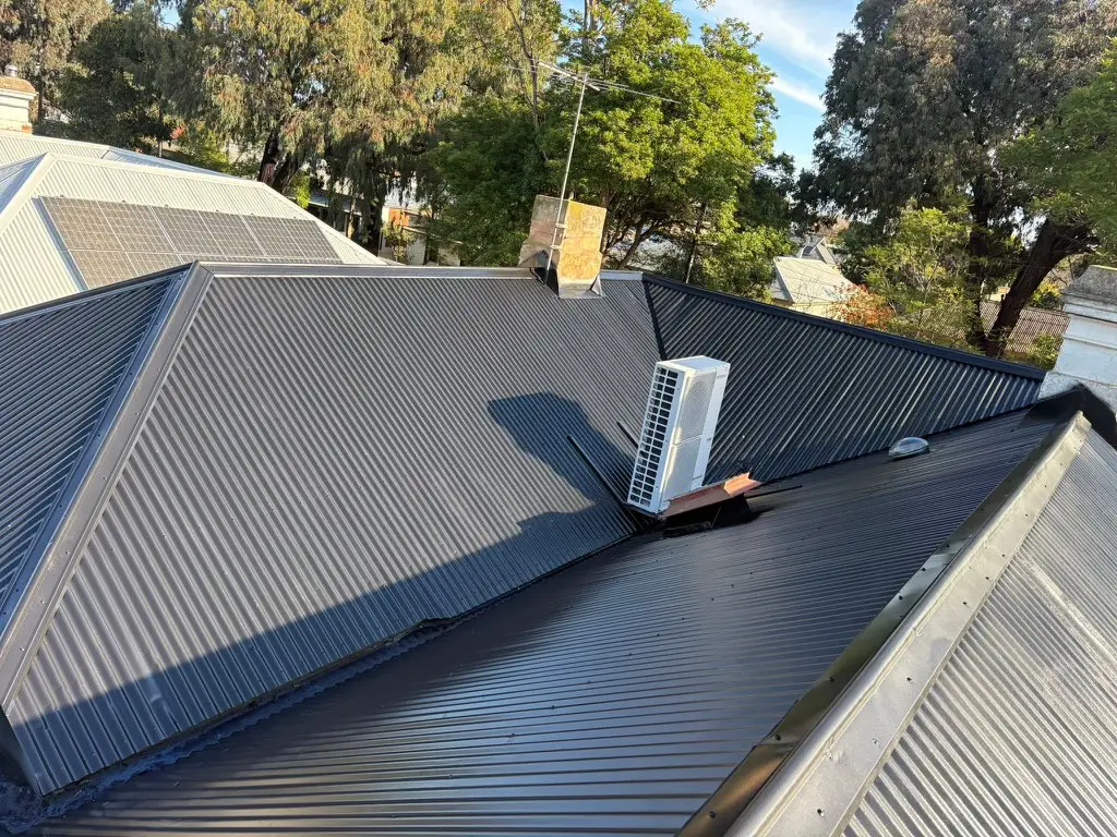 Finished charcoal corrugated roof with new flashings